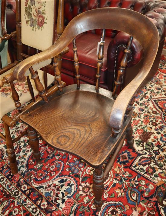 A Victorian elm and beech smokers bow chair